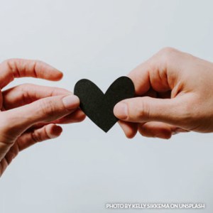 Heart cardboard held with 2 hands