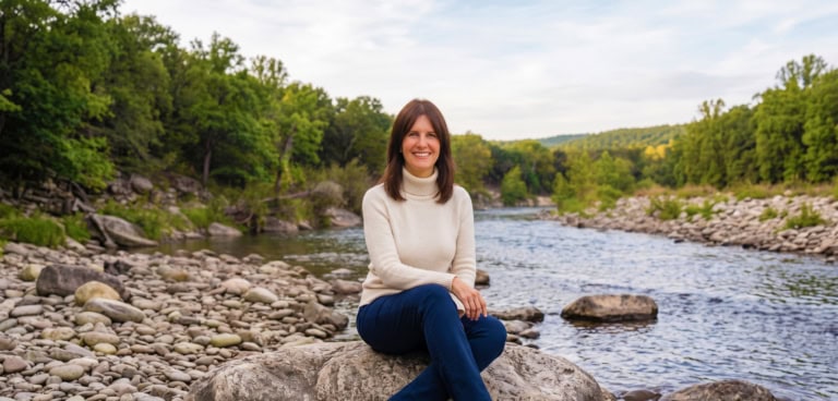 Melissa Dawn sitting by a river